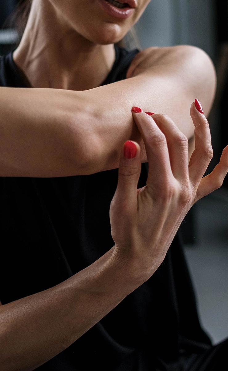 Close Up of Woman Holding Elbow