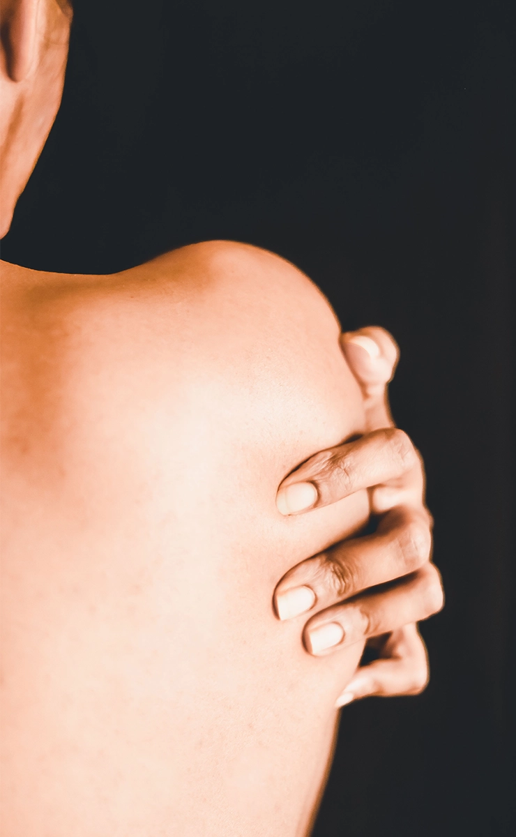 Close Up of Woman Holding Shoulder